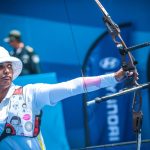 a woman holding a bow and arrow